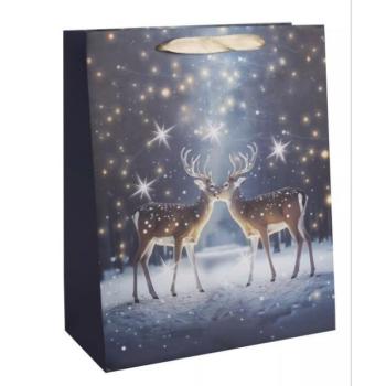 Ajándéktasak rénszarvas mintával - 26 x 32 cm kép